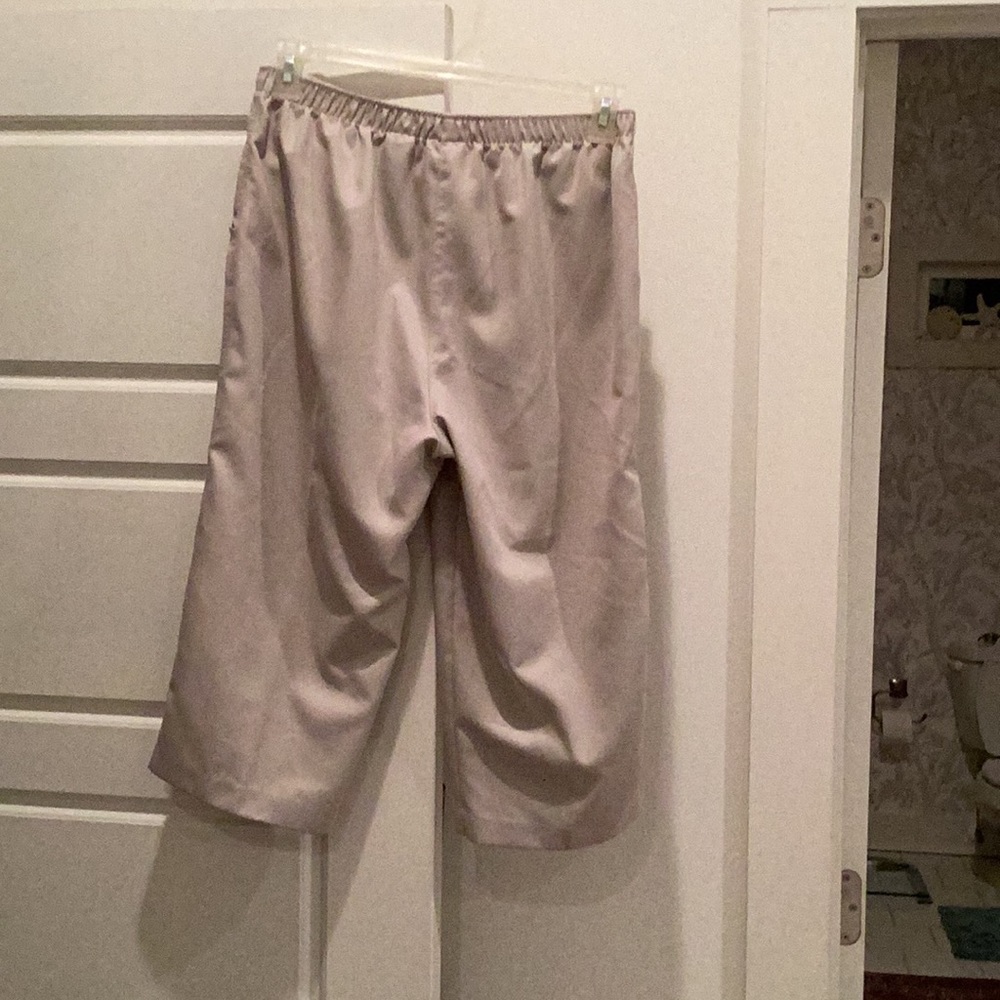 Capri, excellent condition, 28 inches total length, lt khaki color